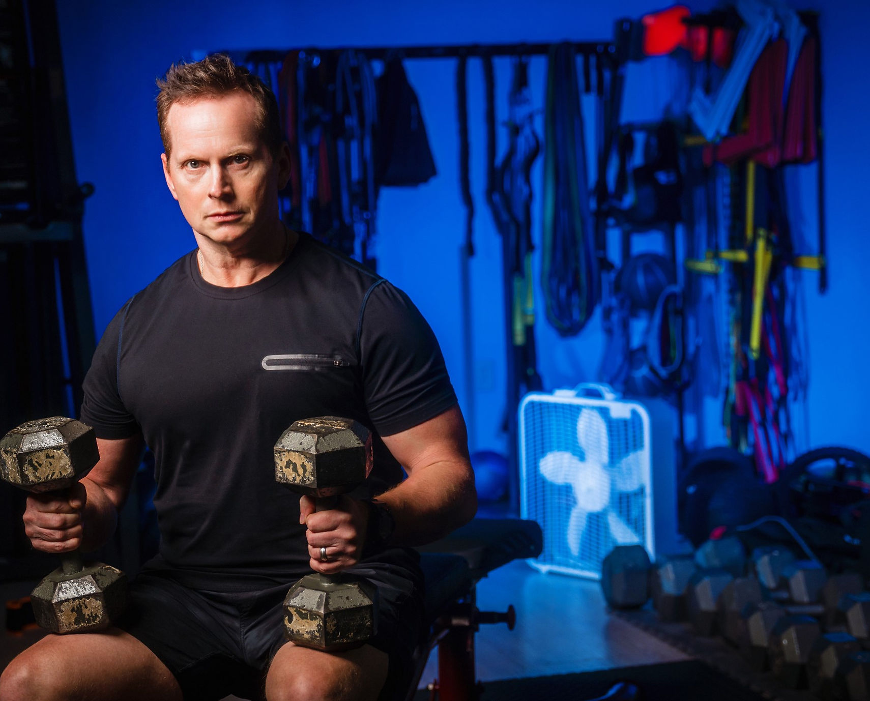 John training with dumbbells at Drive
